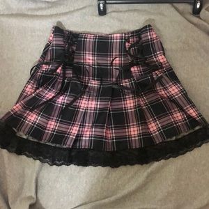 basically brand new. was too big for me. pink/black plaid skirt from shein